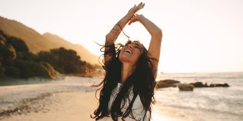 Carefree, woman on beach