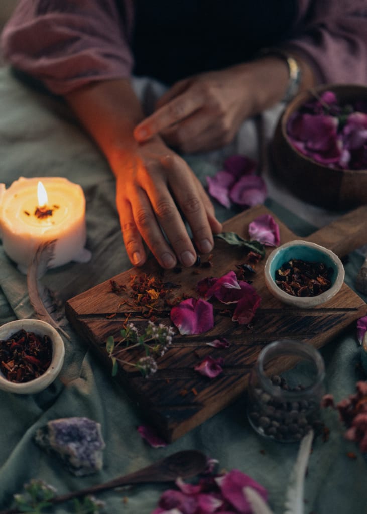 Hands in cacao ceremony spring